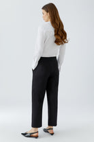 Oui NEYA black culotte trousers with relaxed straight legs – back model view