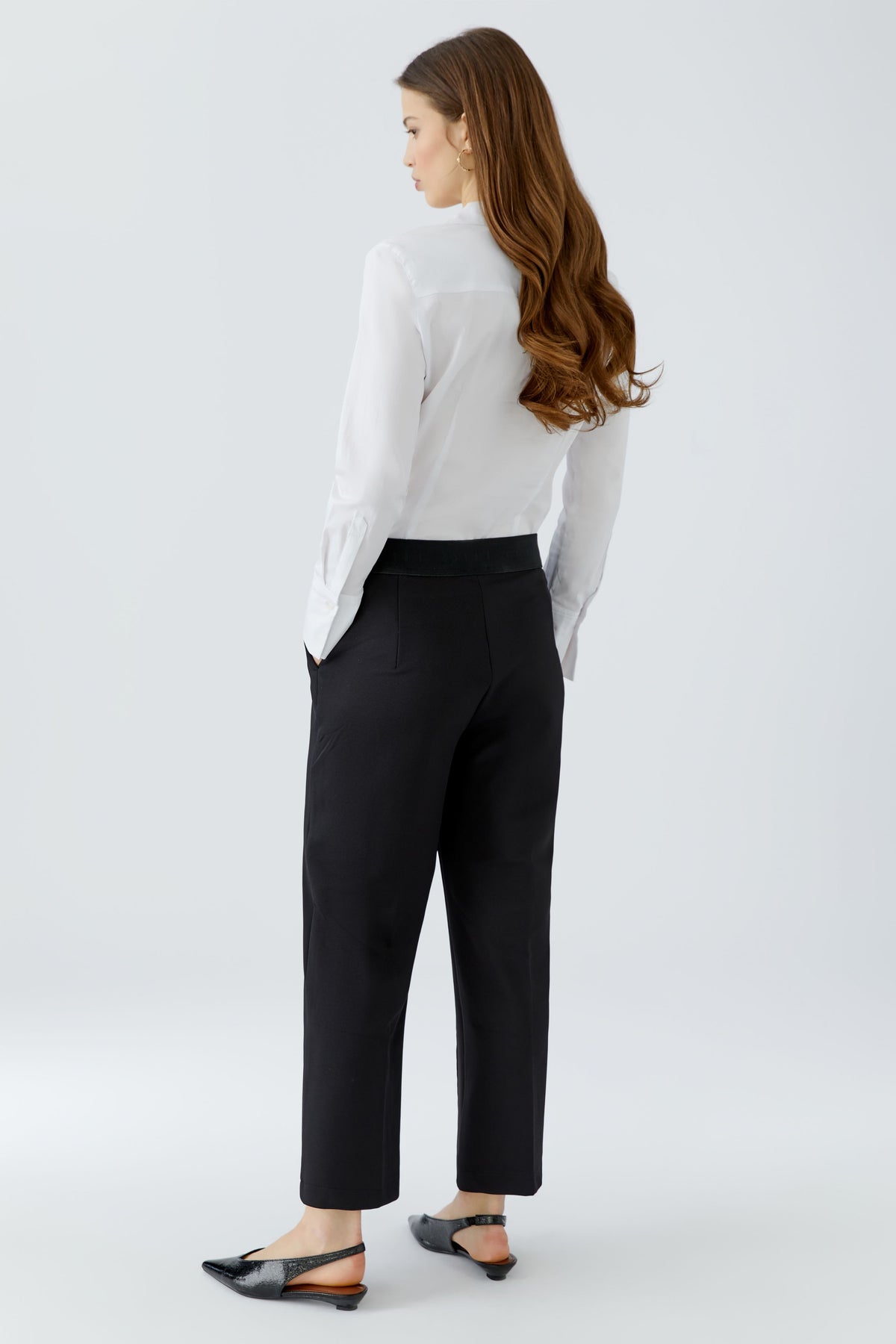 Oui NEYA black culotte trousers with relaxed straight legs – back model view