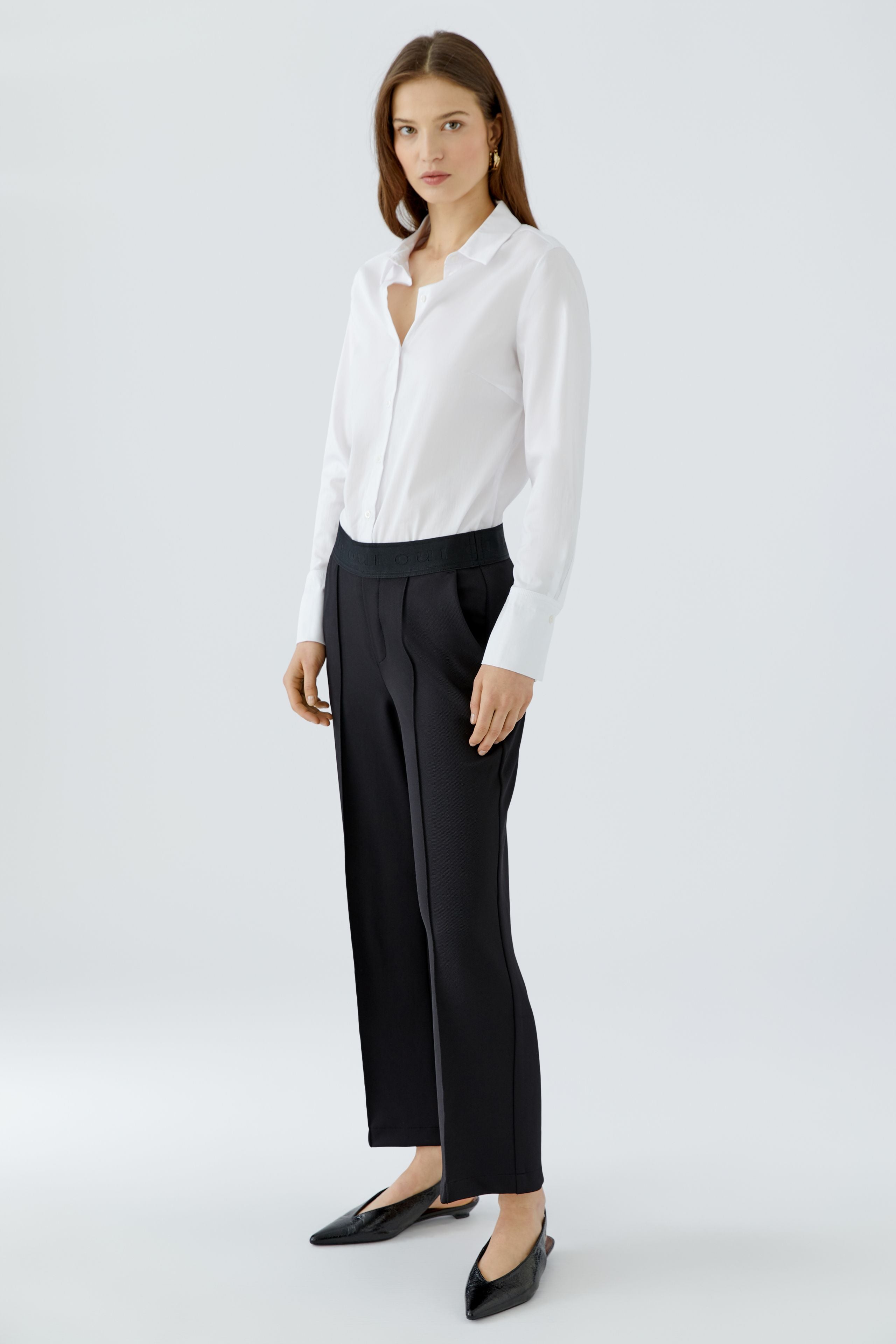 Oui NEYA black cropped culotte trousers styled with white shirt – three-quarter model view