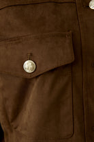 Close-up of Oui brown faux suede trucker jacket pocket and button detail