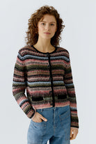 Oui pink and green knitted jacket worn buttoned with denim jeans