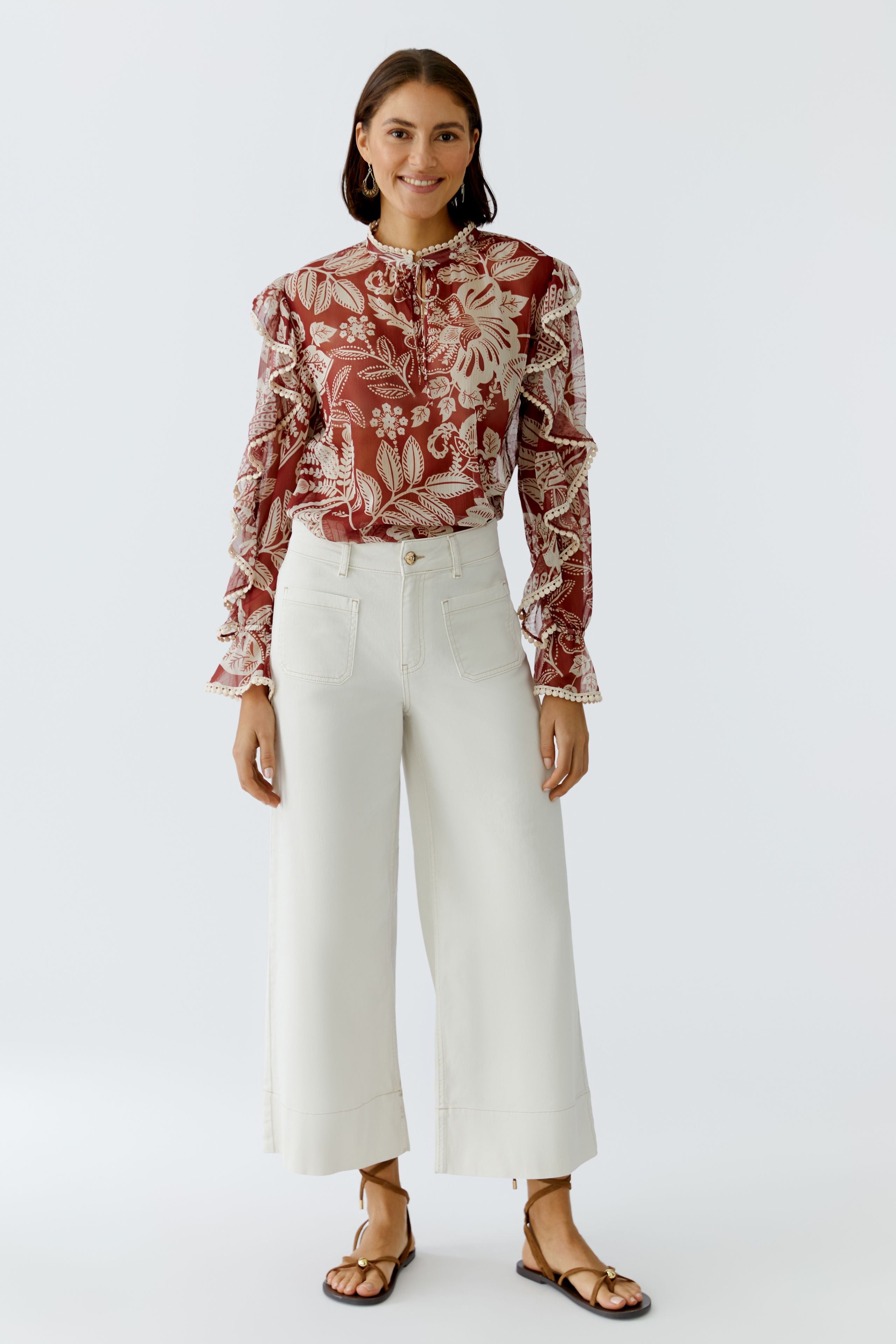 Oui red floral blouse styled with white trousers
