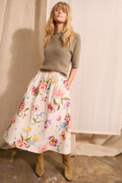 Oui olive green knit jumper worn with floral skirt – lifestyle image