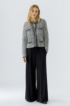 Oui black and off-white knitted jacket cardigan styled with black trousers