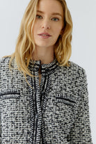 Oui black and white bouclé cardigan close-up showing contrast trim