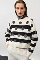 Oui black and white sequin stripe jumper styled with neck scarf – model view