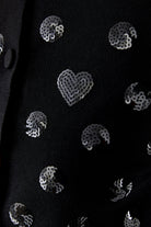 Oui black embellished fine knit cardigan styled with white trousers