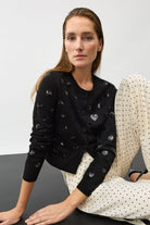 Oui black Sparkly knit cardigan styled with white trousers