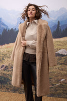 Oui beige half zip jumper layered under camel coat – lifestyle view