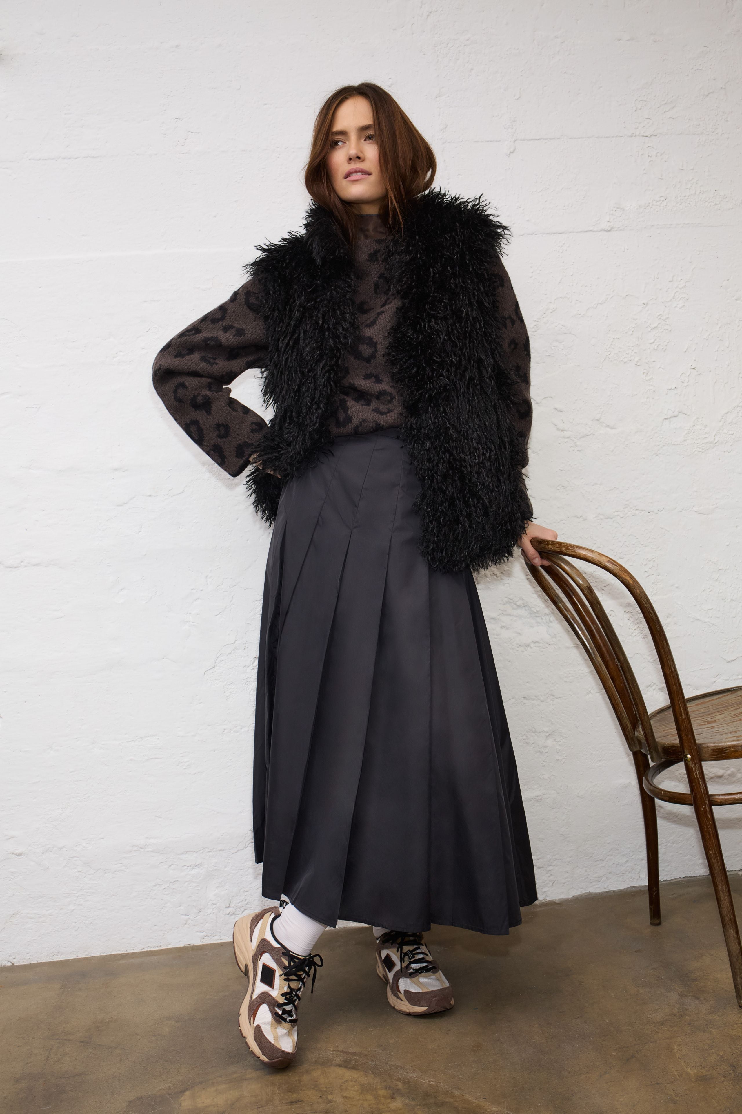 Oui brown leopard jacquard jumper styled with black midi skirt – lifestyle view