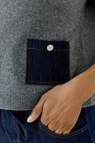 Oui grey jumper with dark denim pocket and silver-tone button – detail view