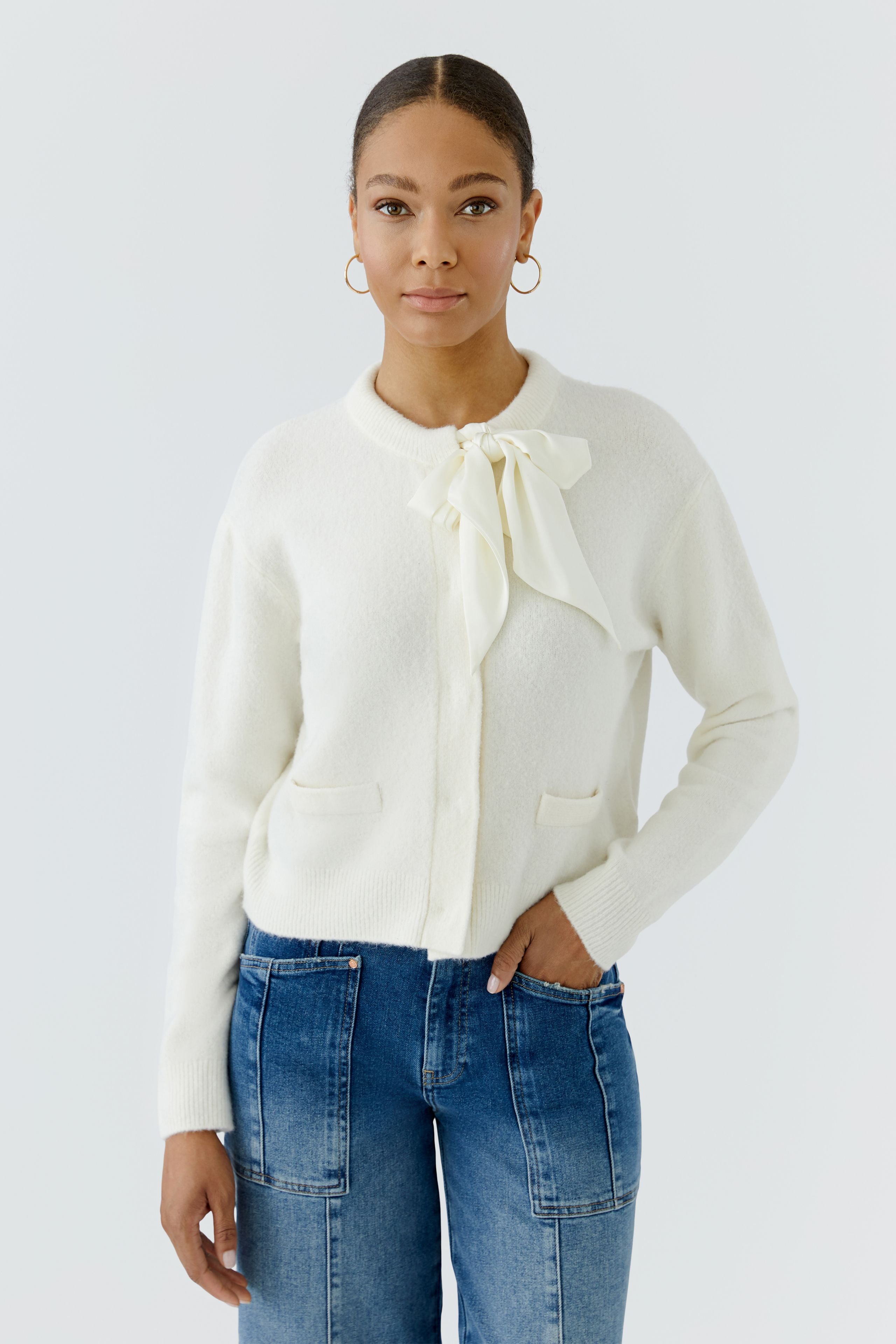 Oui cream knitted cardigan with satin bow neckline and concealed front – model view