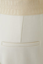 Oui cream pull-on wide leg trousers with logo elastic waistband and mock back pocket – detail view