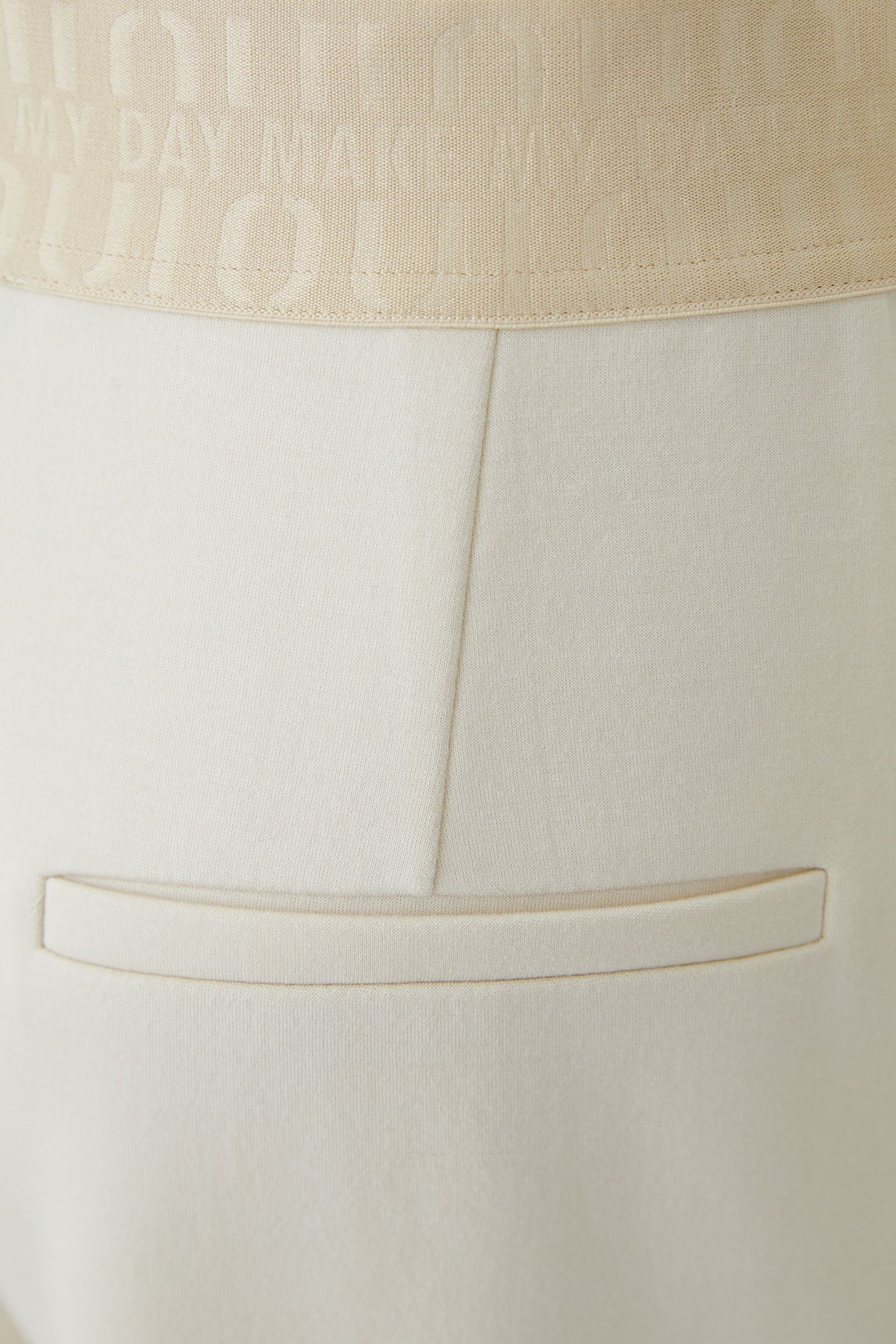 Oui cream pull-on wide leg trousers with logo elastic waistband and mock back pocket – detail view