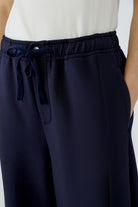 Oui navy scuba trousers with elasticated drawstring waist and side pockets – detail view