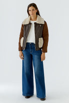 Oui brown reversible teddy trim jacket with quilted sleeves and blue jeans – full outfit view