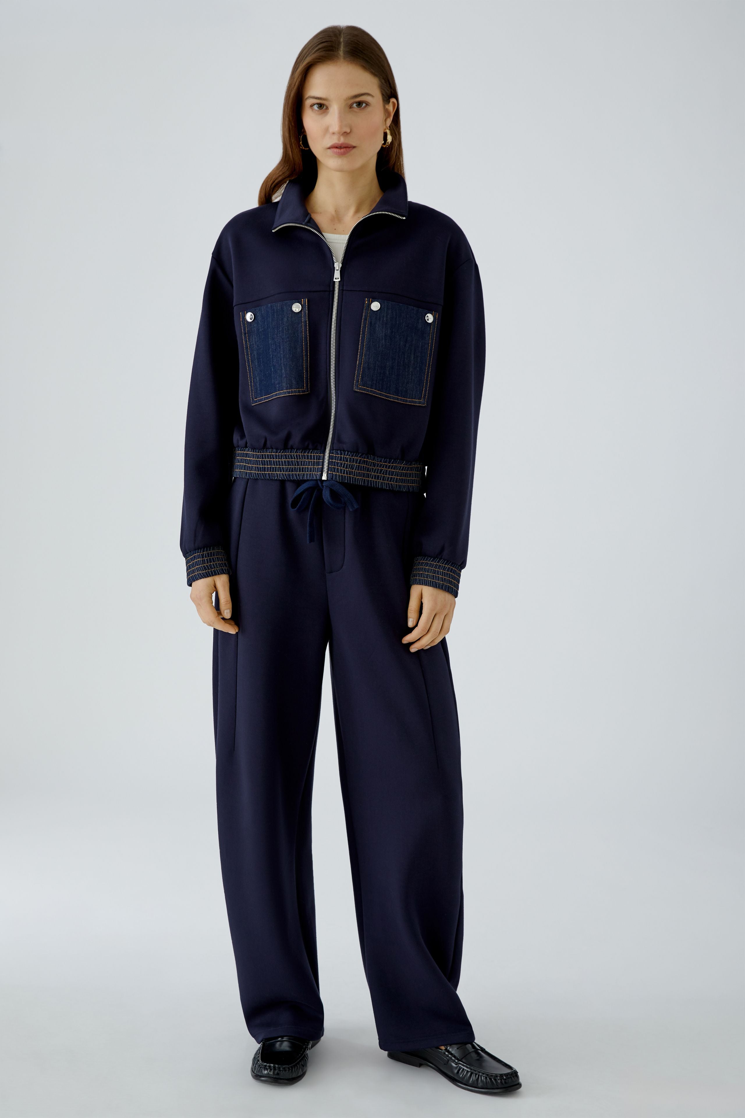 Oui navy scuba blouson jacket styled with matching wide-leg trousers – full model view