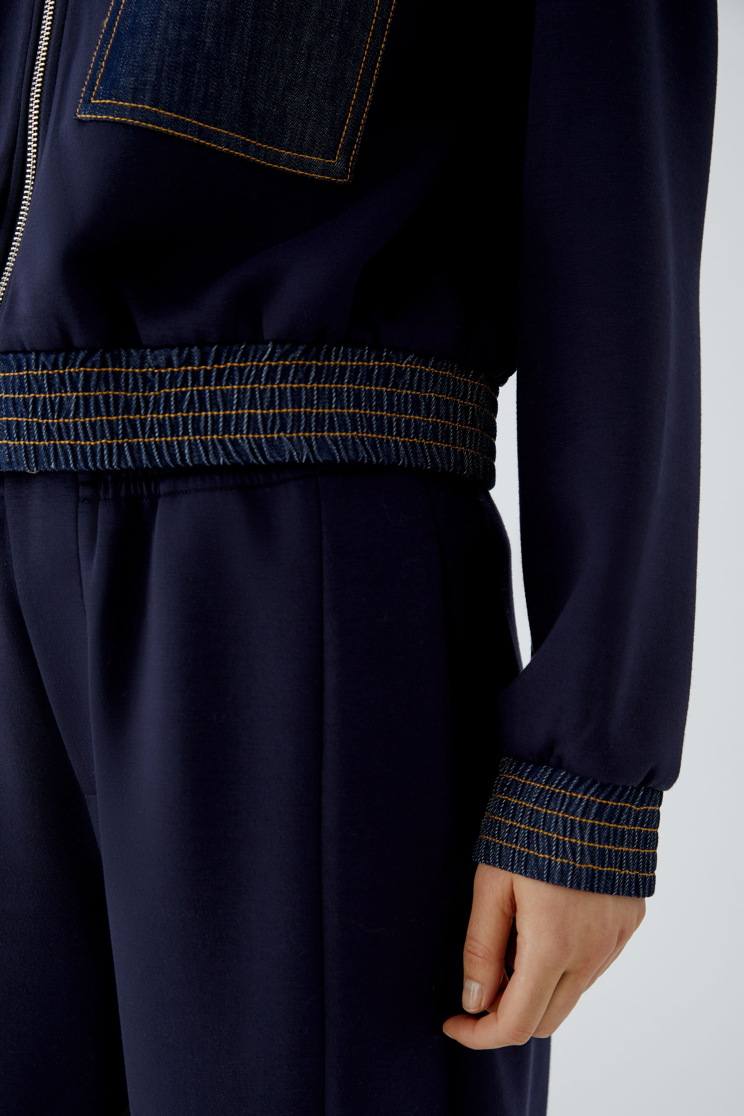 Oui navy blouson jacket with denim-trimmed cuff and elasticated hem – detail view