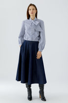 Oui dark denim high-waisted A-line midi skirt styled with blue shirt