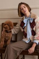Oui cream argyle cardigan styled over bow blouse – lifestyle view