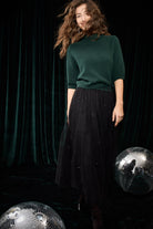 Oui black embellished tulle party midi skirt styled with green top – lifestyle view