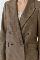 Oui brown micro-check blazer showing dark buttons, peaked lapels and woven check pattern – detail view