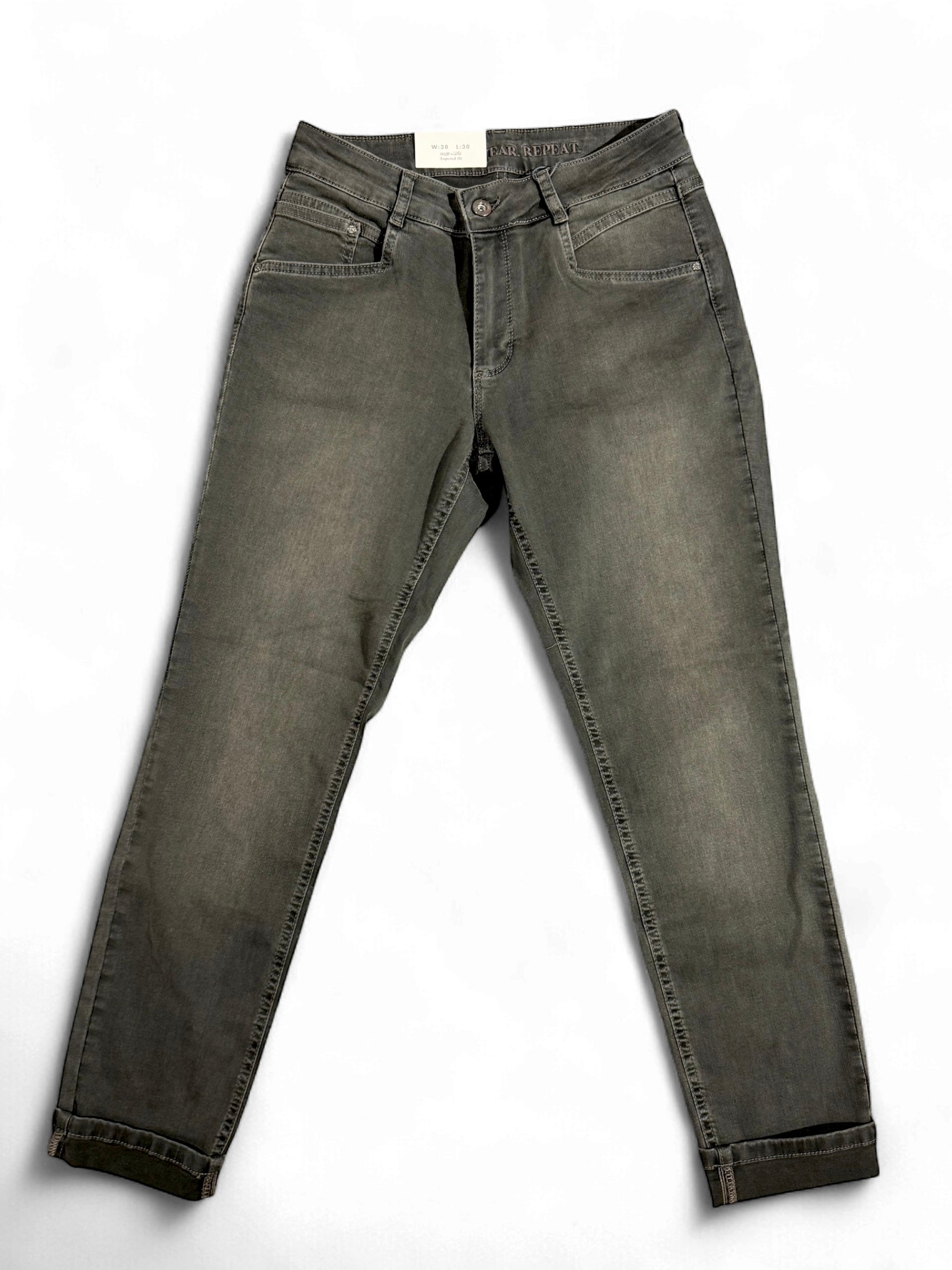 Flat lay of Para Mi Bowie slim leg jeans in faded green denim