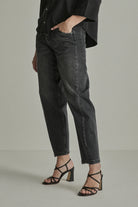 Para Mi Coco washed grey barrel leg jeans with curved seams and tapered ankles – side model view