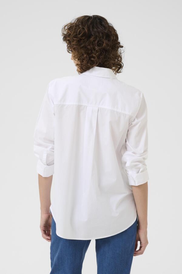Back view of tailored white cotton women’s shirt with long sleeves
