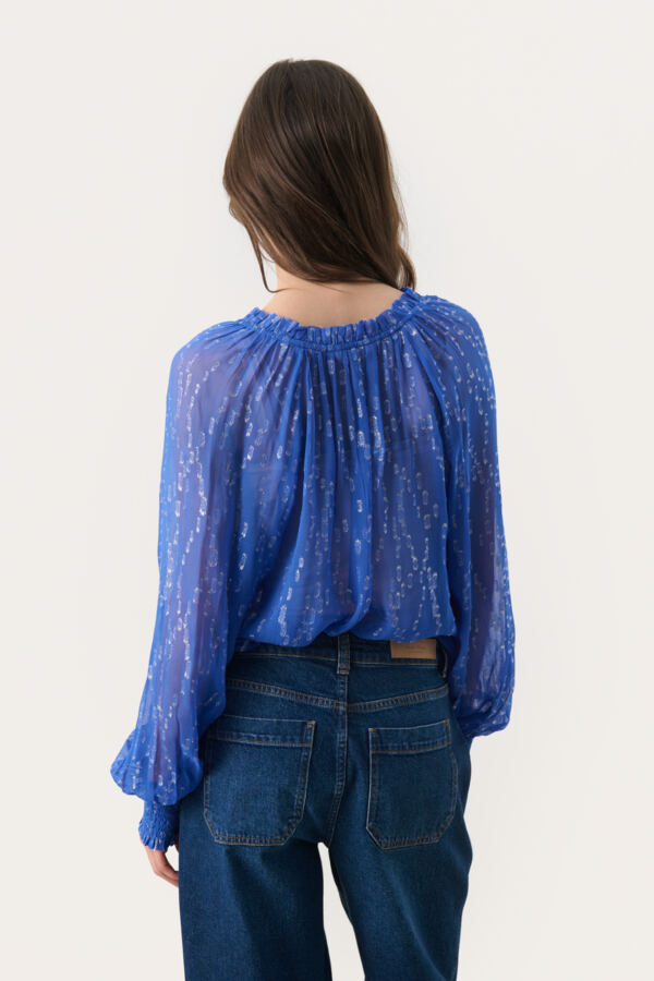 Lightweight long sleeve blouse styled with dark denim