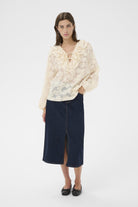 Part Two Zaira long sleeve blouse styled with denim skirt 