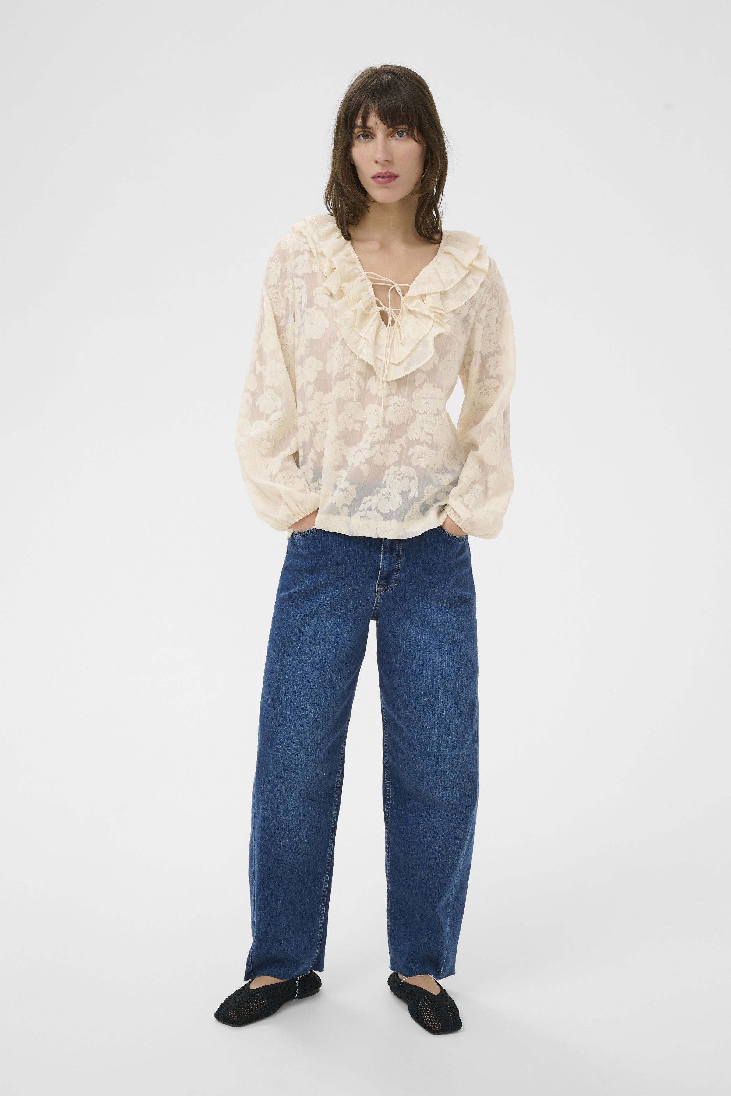 Part Two Zaira cream blouse styled with denim jeans