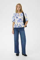 Part Two Azelia blue an white floral peplum top styled with denim