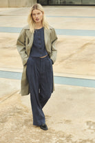Part Two Aliya navy wide leg trousers model wearing with coat outfit
