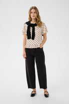 Part Two Adelena black barrel leg cropped jeans styled with a polka dot top