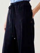 Pennyblack Vischio navy velvet jersey trousers showing drawstring waistband and side pocket – close-up