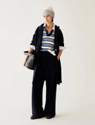 Pennyblack navy wide-leg joggers styled with a striped knit and long coat