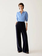 Pennyblack Vischio navy relaxed wide-leg trousers styled with a blue shirt – full model view