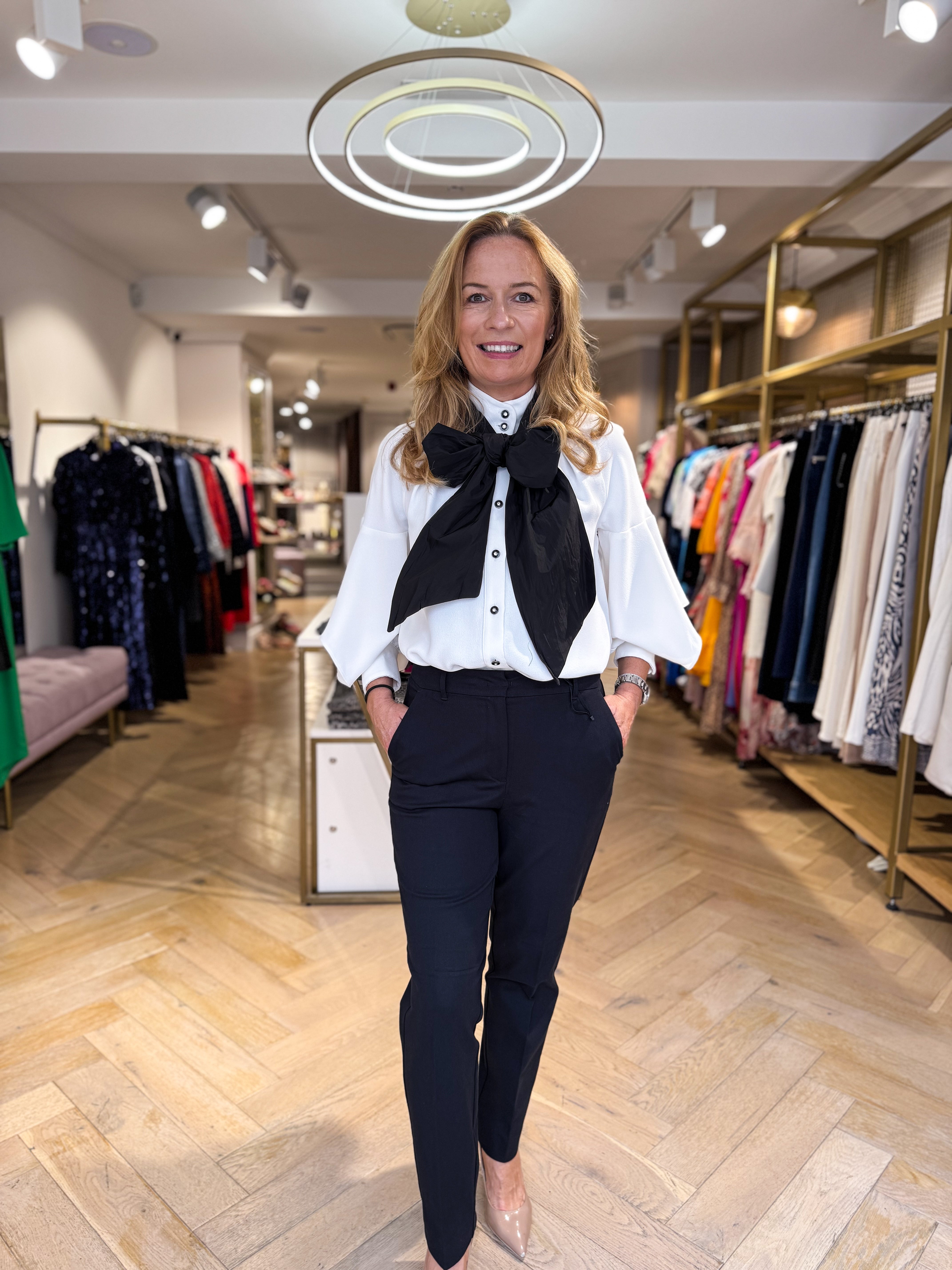 Front view of Penny Black Pennyny black slim-fit trousers styled with off-white blouse