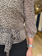 Side view of Pennyblack Sesia leopard print top with long sleeves and belt