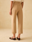 Straight leg cotton denim trousers camel back view with patch pockets