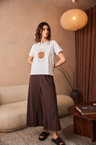 Peruzzi Circle Line Graphic Print Top styled with wide leg trousers for casual wear