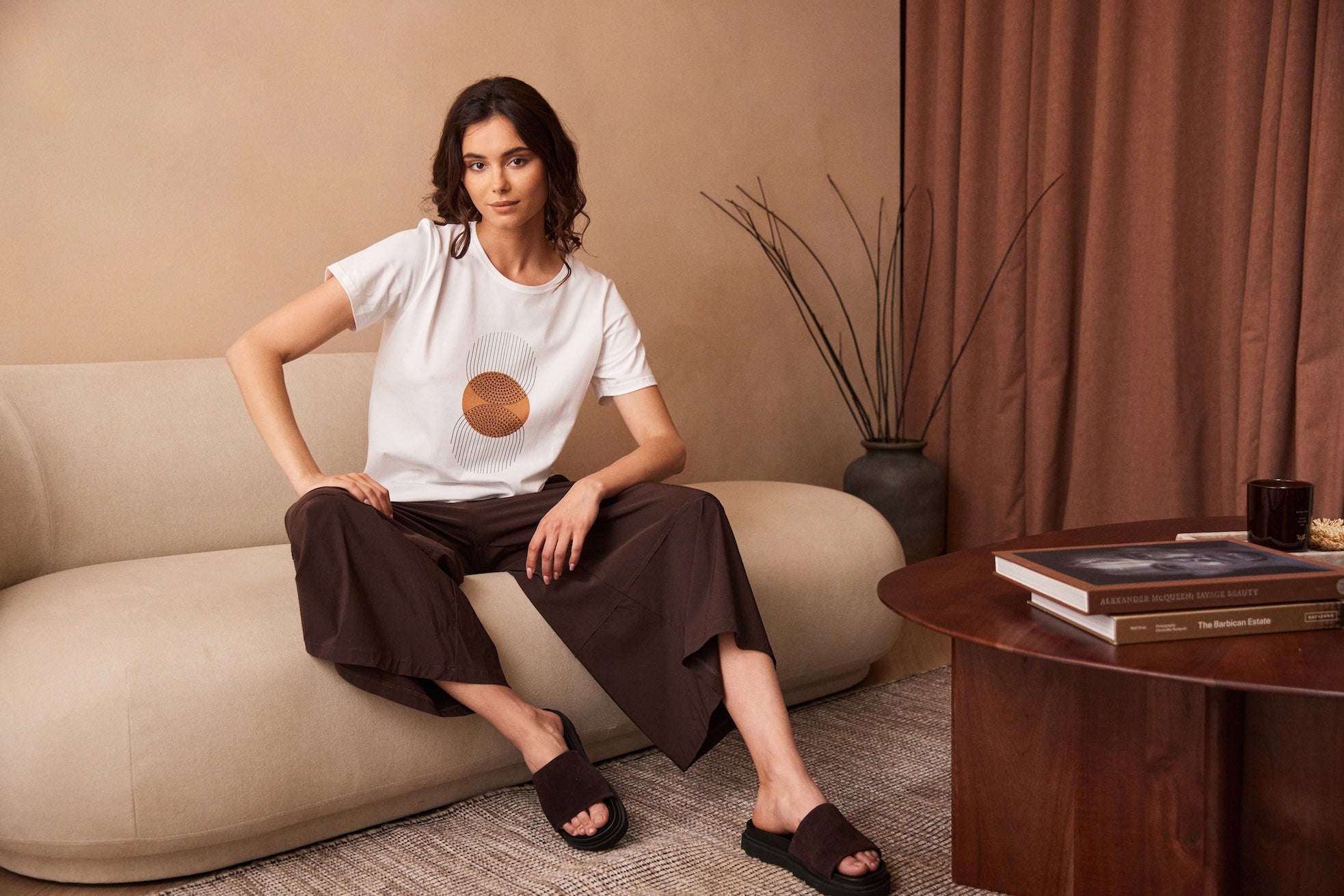 Peruzzi Circle Line Graphic Print Top casual styling with short sleeves and round neck