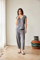 Peruzzi grey stripe trim top styled with matching trousers