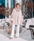 Pia Rossini Ariana beige faux suede winter cape with faux fur trim on model