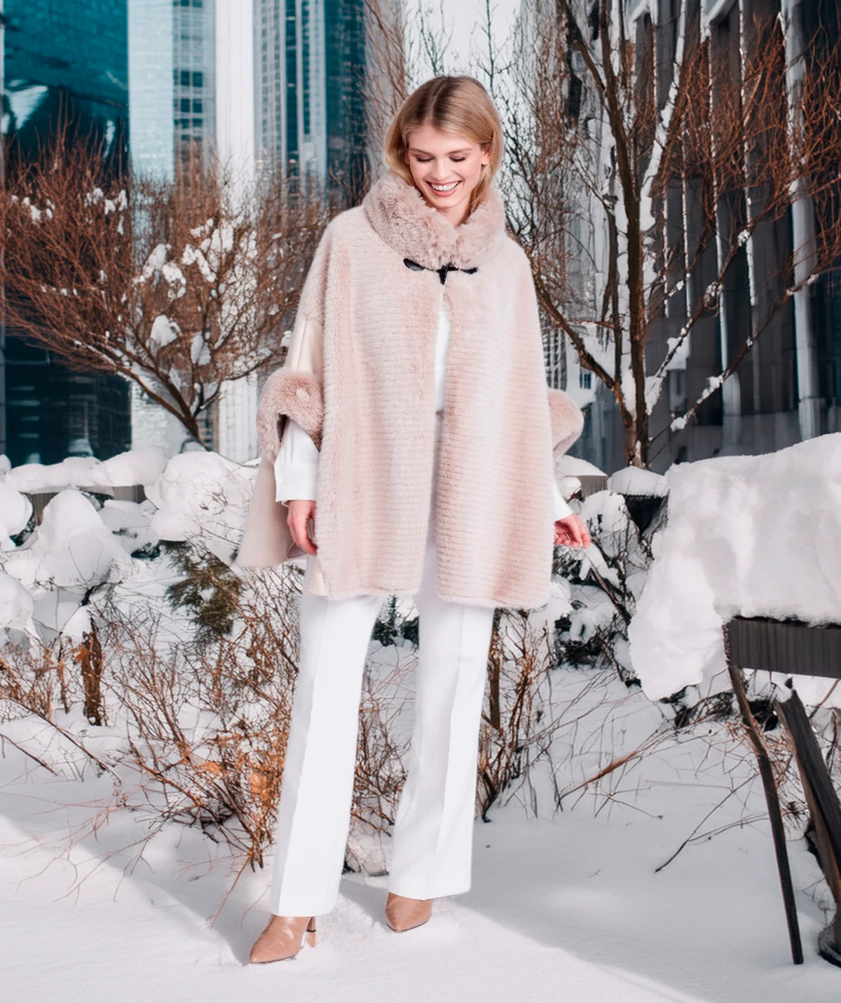 Pia Rossini Ariana beige faux suede winter cape with faux fur trim on model