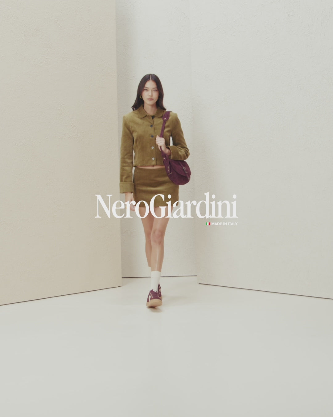NeroGiardini casual trainers styled with socks – Burgundy option on model