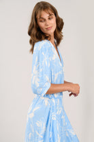 Sisters July sky blue floral midi dress side profile with puff sleeves