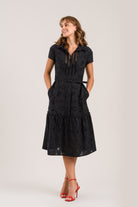 Sisters Milo cotton tiered shirt dress in black with lace panel detail and belt front view
