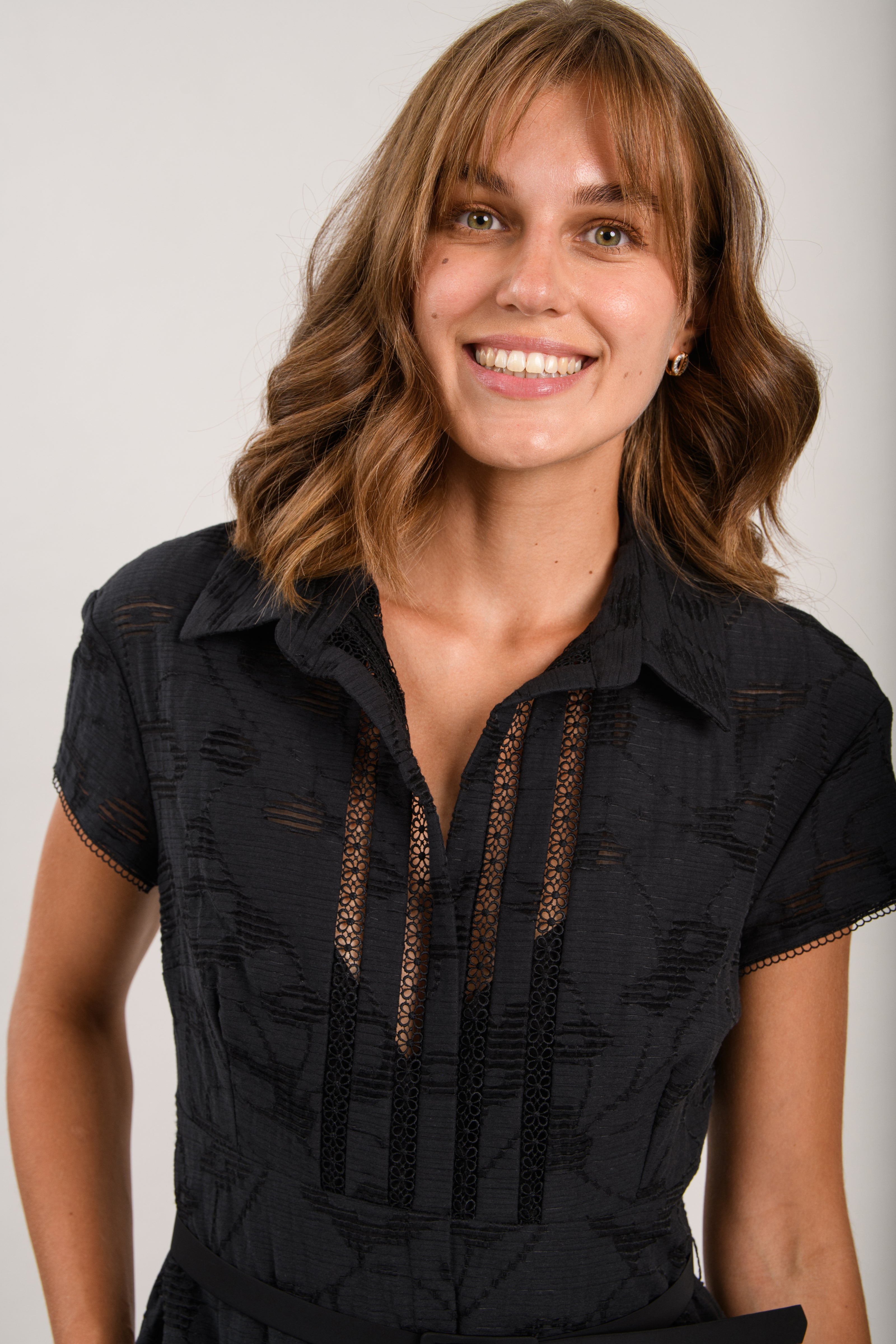 Sisters Milo black cotton tiered dress back view with waist belt